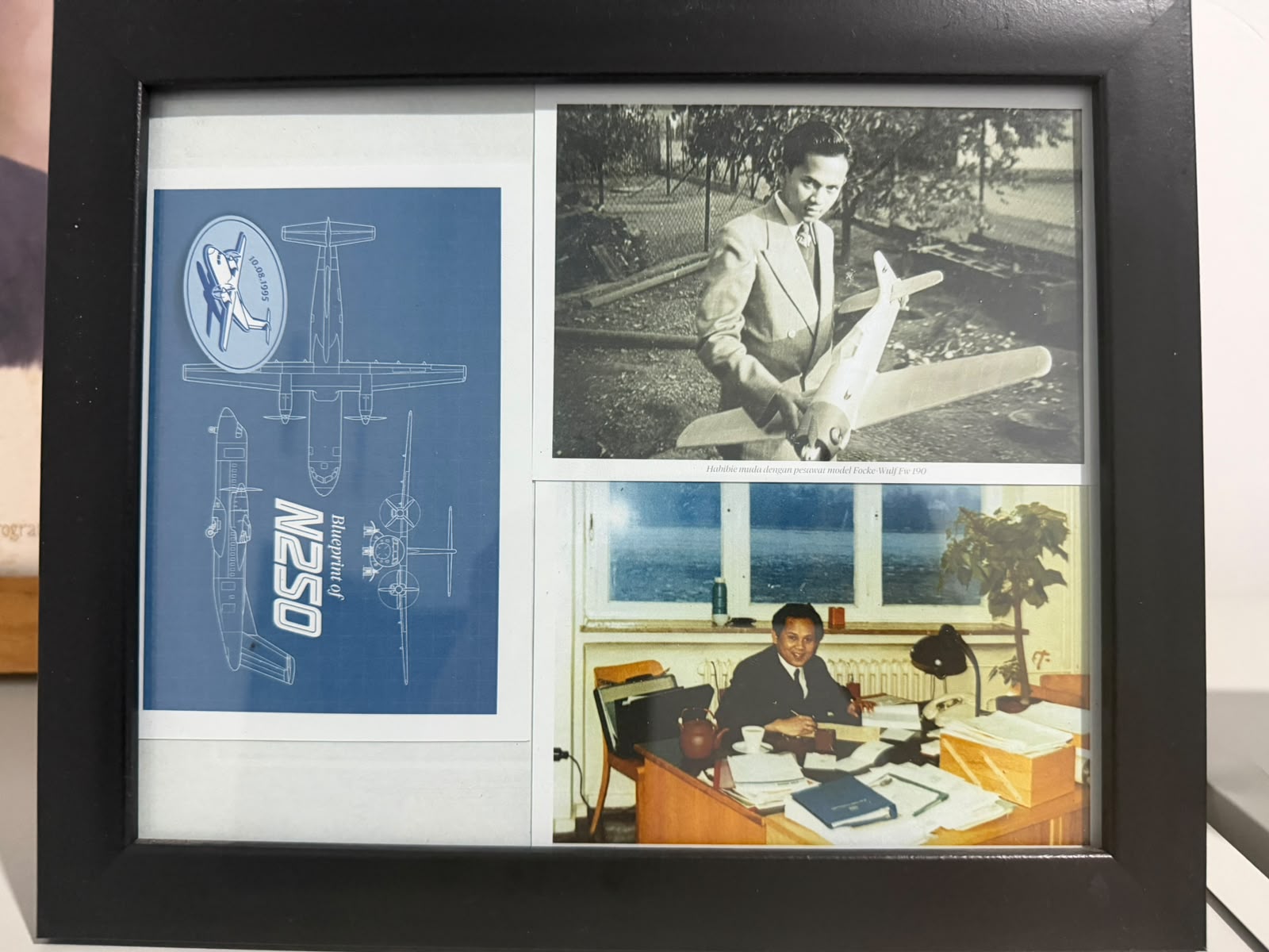 A framed B.J. Habibie and N-250 blueprint display in Rahmat Wibowo's room